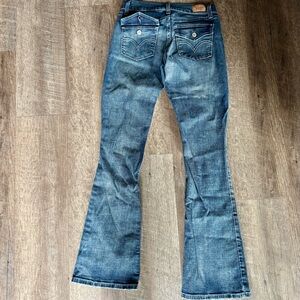 Vintage Levi’s 524 Too Superlow Button Flap Back Pockets w/ Button Closure Jeans